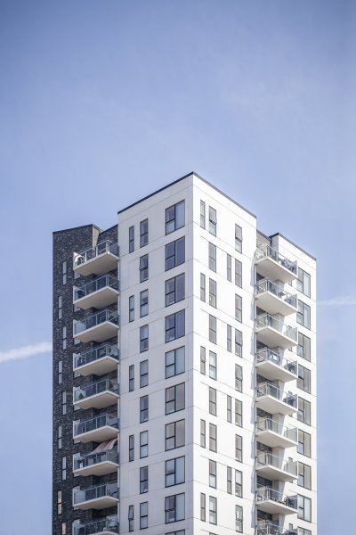 vertical-shot-white-building-clear-sky.jpg